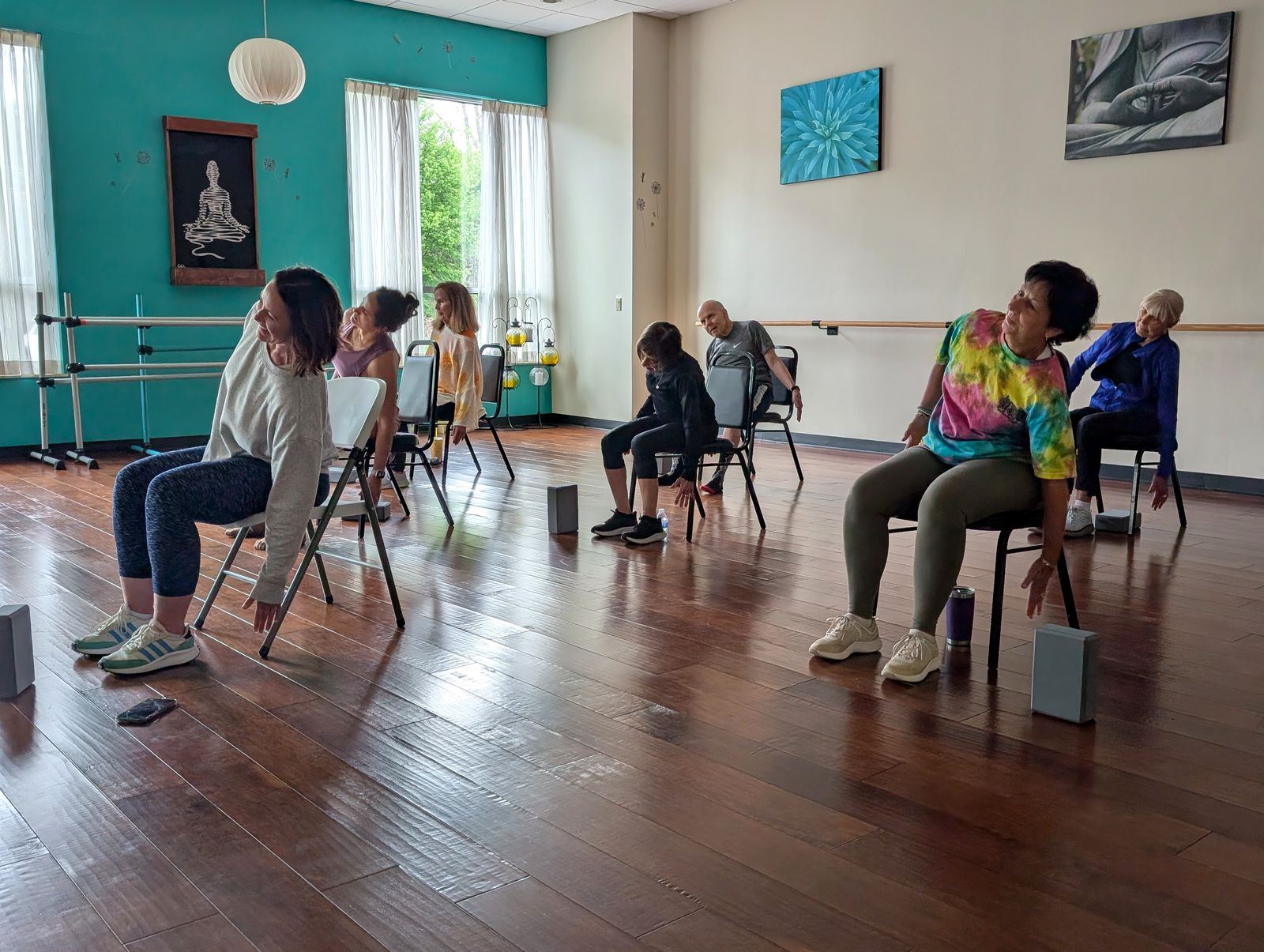 A chair yoga class stretching together at VIVE Health & Fitness in Kingston, PA