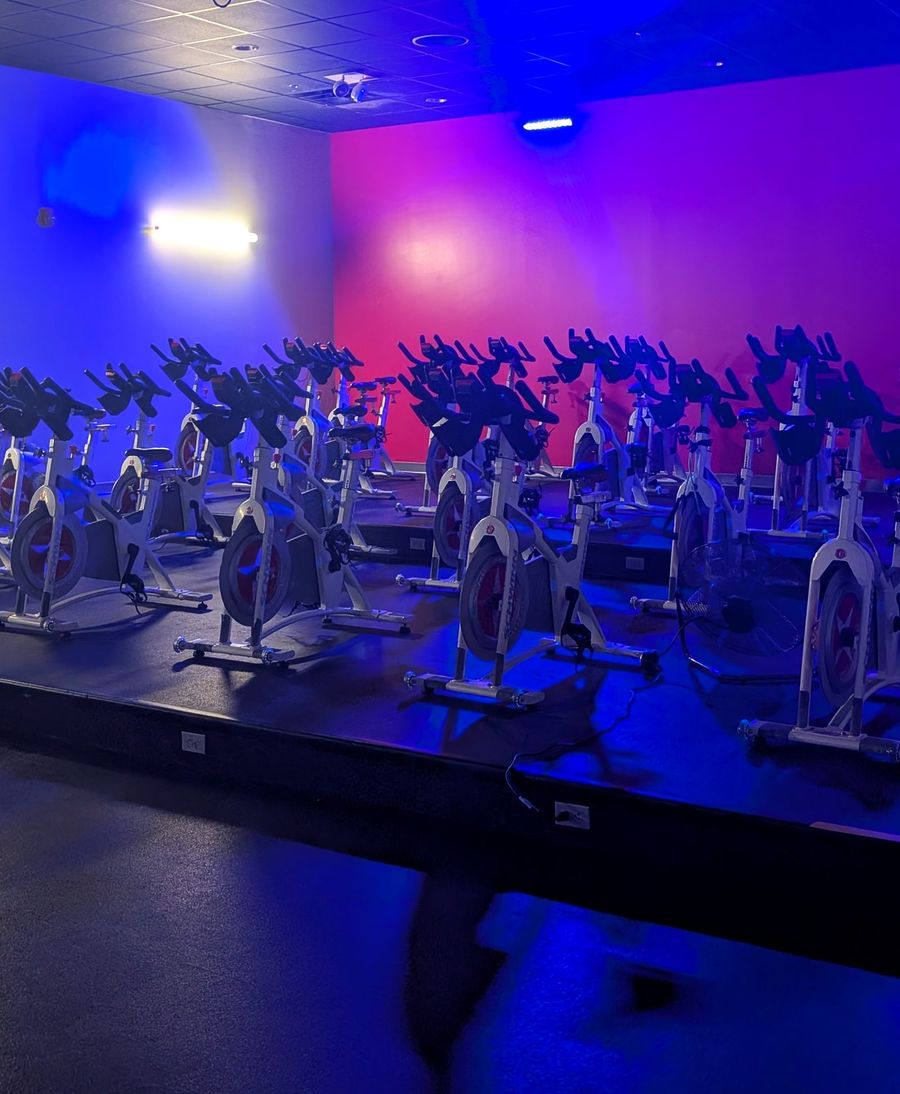 The VIVE cycle studio glowing blue and red before class