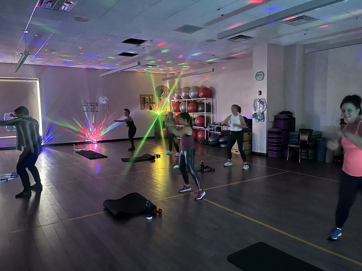 A dance fitness class in the VIVE group fitness studio